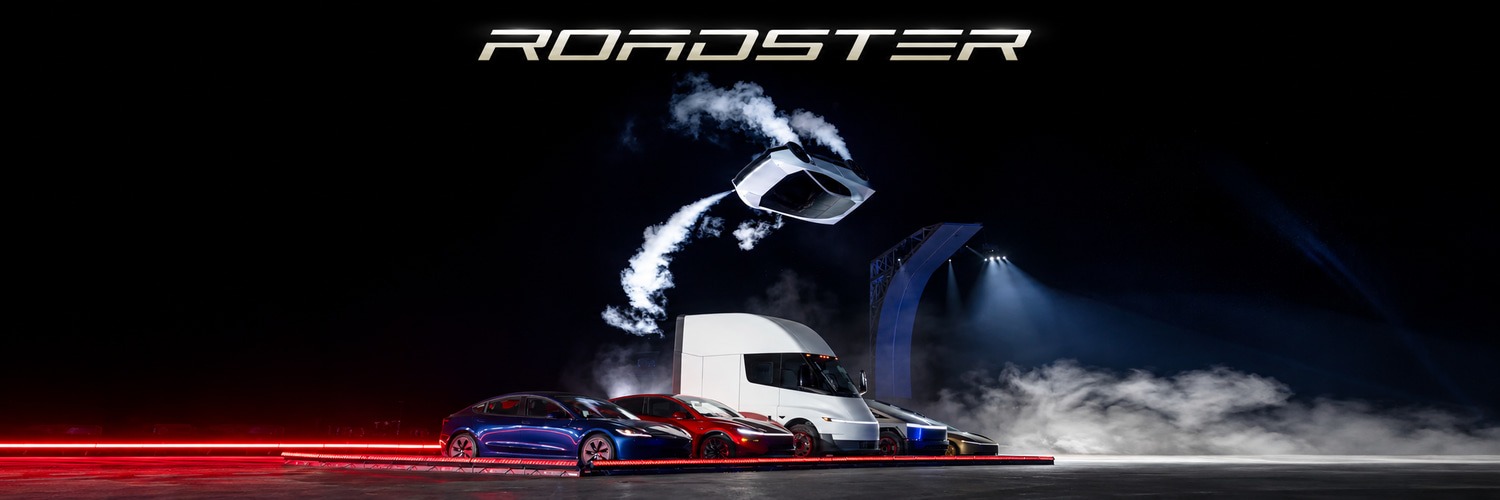 Night lineup of Tesla vehicles beneath an airborne Roadster, with ROADSTER in gold across the sky